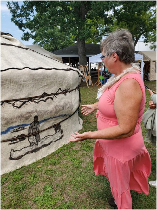 Linda Johnson-Morke speaks about the Mongolian yurt on display. Photo: Letty Klein.